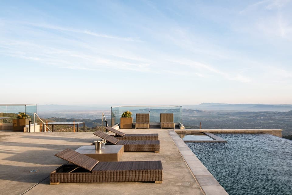 Grilling and hangout area with ping pong at the end of the lawn.