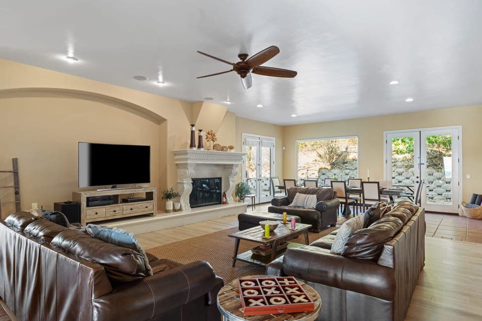 Spacious living room and flat-screen television. (Please note: Both the indoor and outdoor fireplaces are unavailable for guest use.)