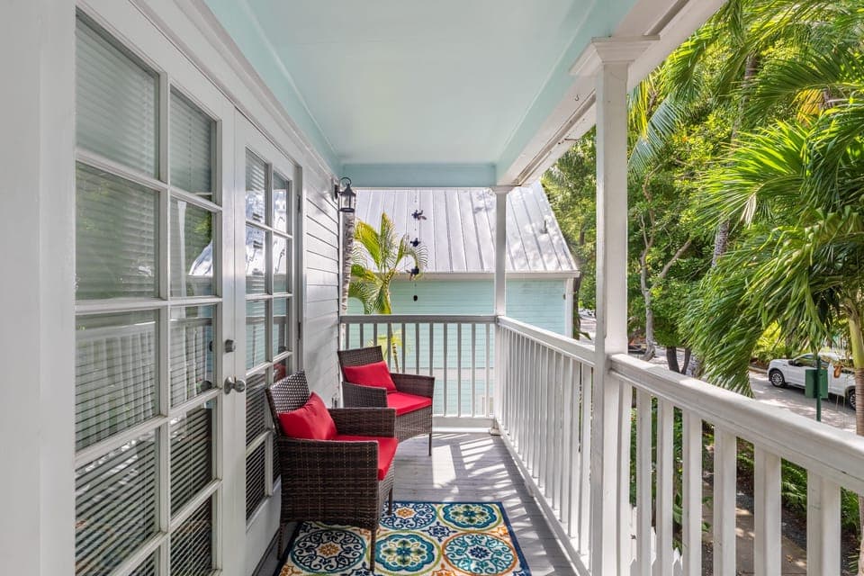 Relax on the front balcony located off the primary bedroom.