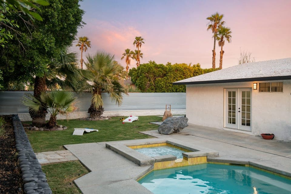 Hot tub and lawn with yard games.