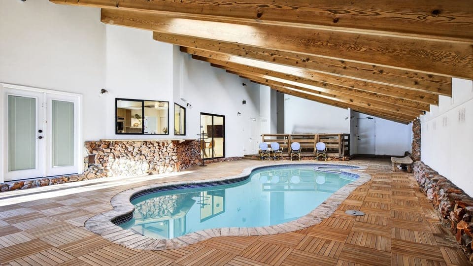 Welcome to Honeypot! Lakefront home with large indoor pool to enjoy a swim any time of the year.