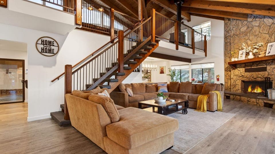 Vaulted ceilings, open design, and a living room fireplace.