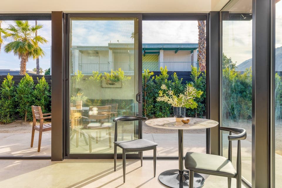 Small table near the windows.