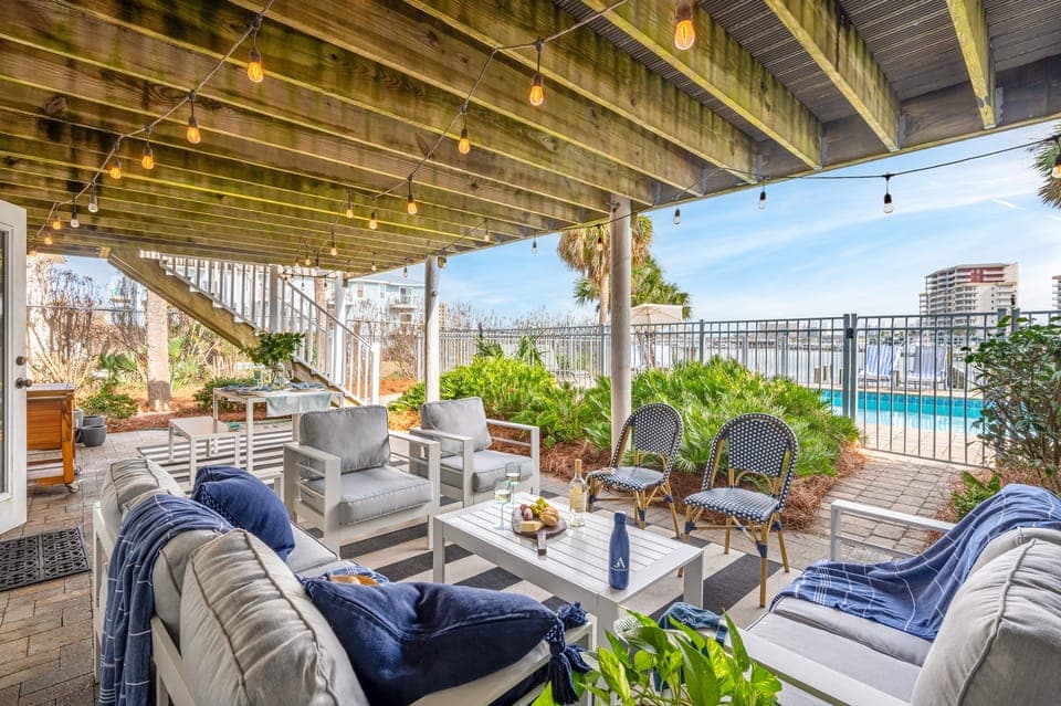 Lower patio lounge is covered with comfortable seating.
