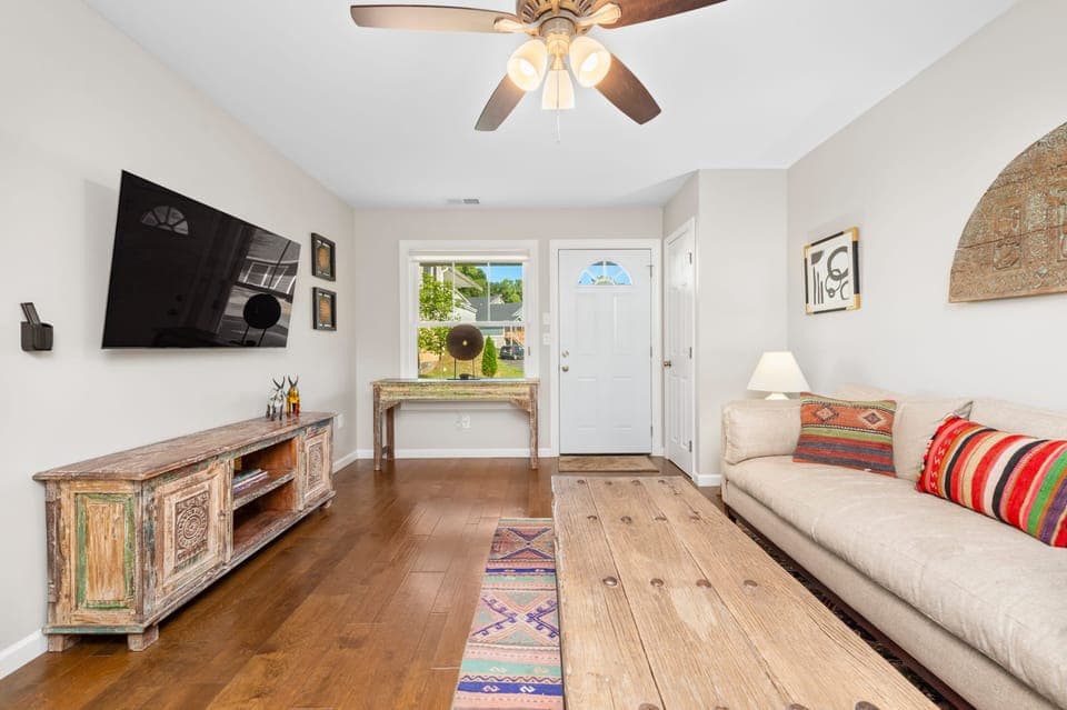 Comfortable living room with a sofa and TV.