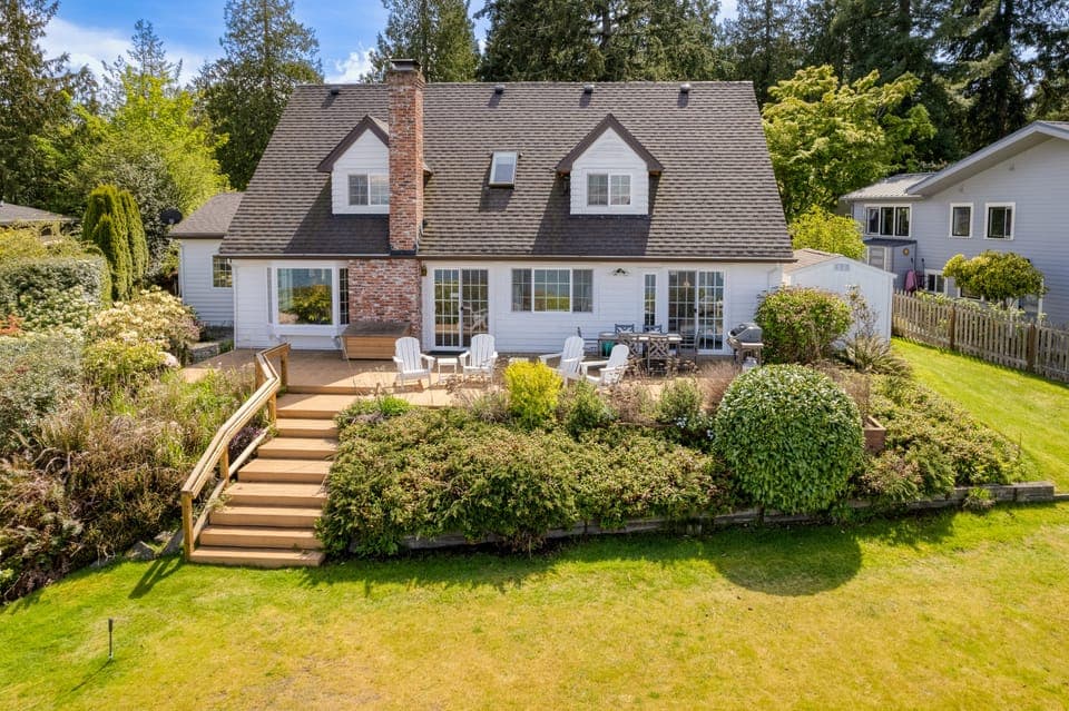 Charming, 2,900 sq. ft. waterfront home perched on 82' high bank.