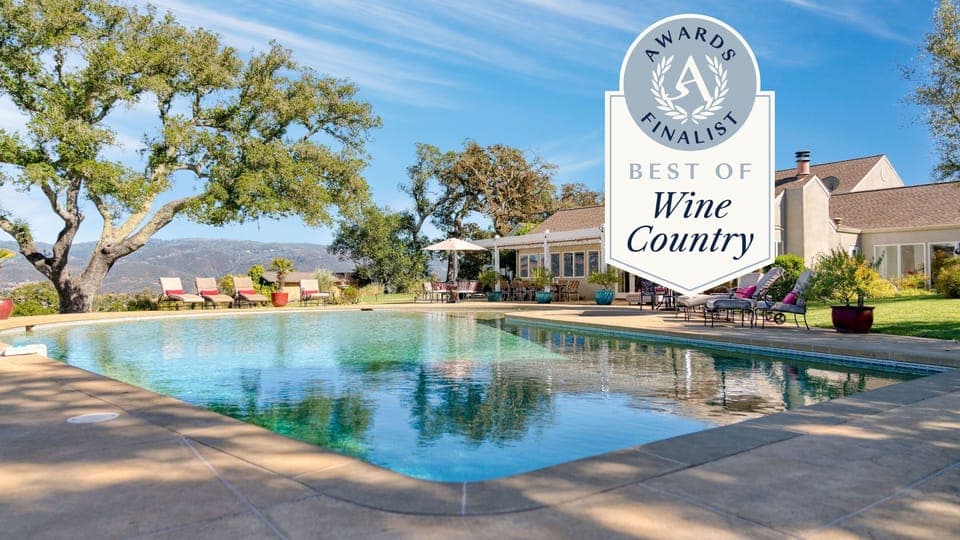 Nestled right next to a vineyard.