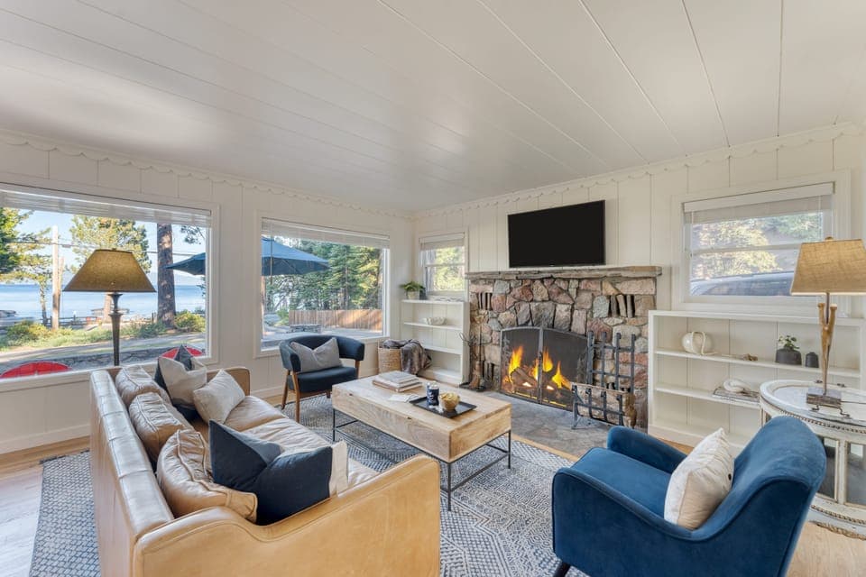 Spacious front patio with outdoor seating and dining areas.