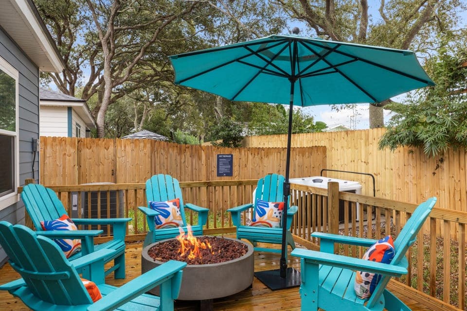 Hot tub and Adirondack-ringed fire pit.