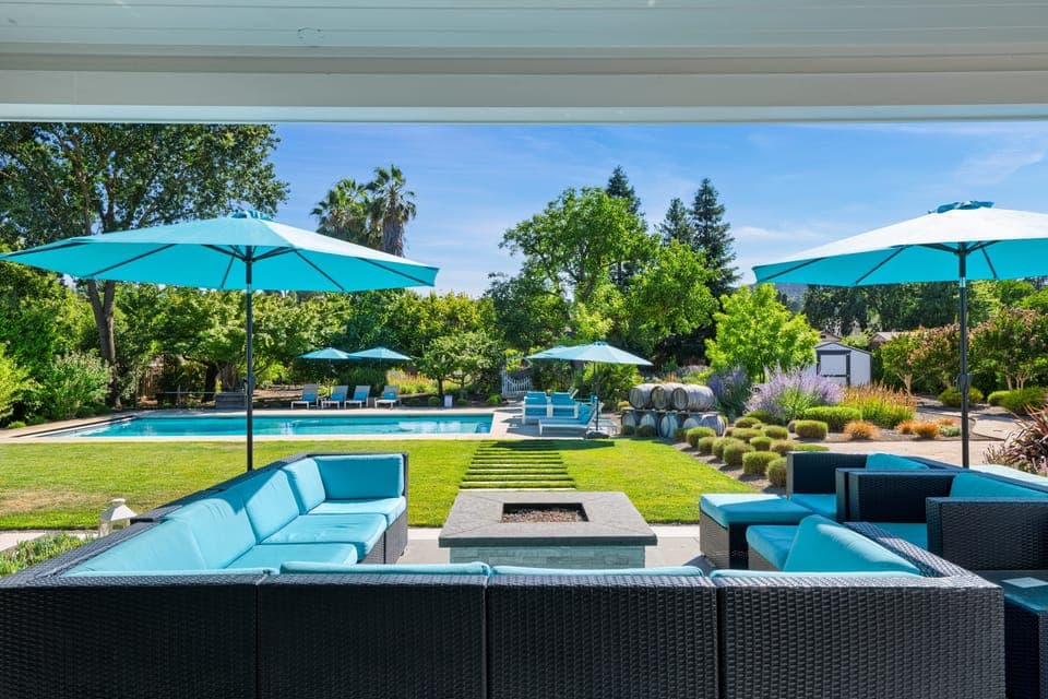 Outdoor lounge area with a fire pit.