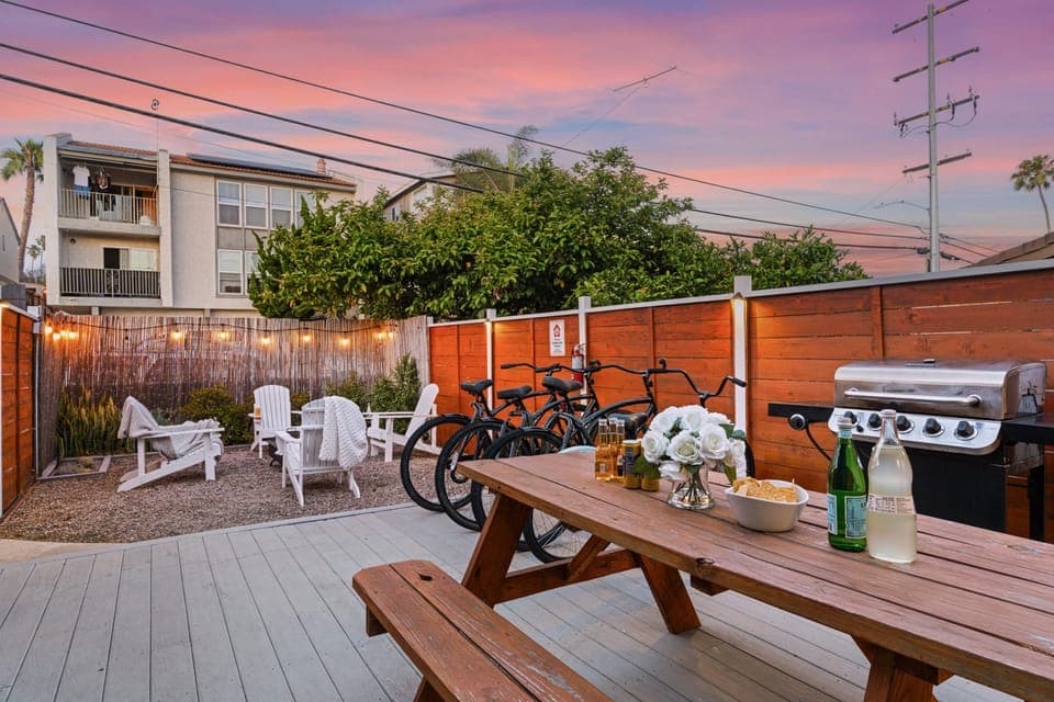 Unwind under the glowing skies in your shared backyard, complete with outdoor dining, BBQ grill, and fire pit.