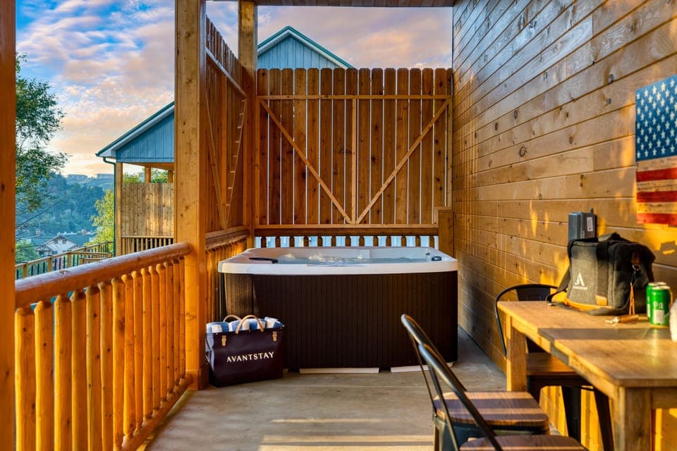 Enjoy the ultimate relaxation in your private hot tub on the deck.
