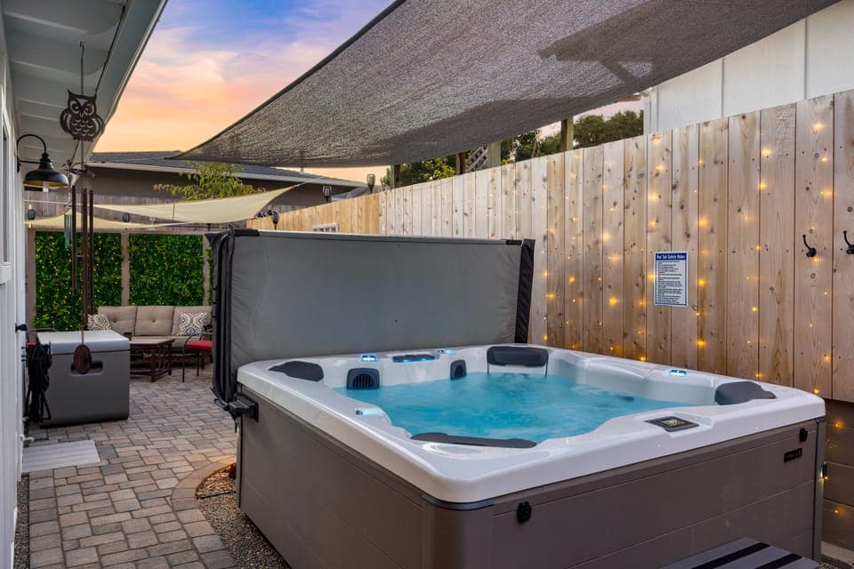 Private hot tub with sun shade.