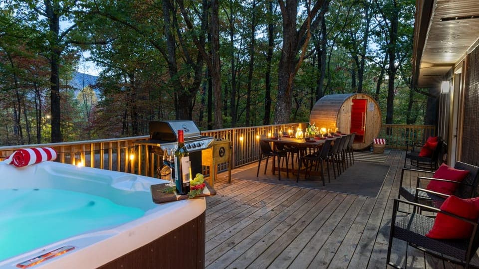 Escape to serenity with our dining space, sauna, and hot tub nestled among the trees.