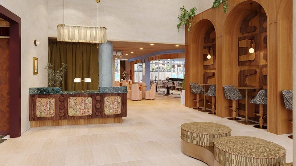 Lobby area with elevator access, modern design, and multiple seating lounge.