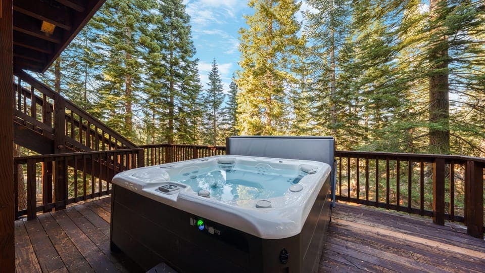 Private hot tub on deck overlooking the forest.