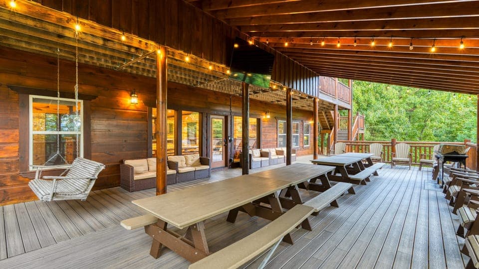 This expansive covered deck is ready for every family reunion, group dinner, or quiet evening swing.