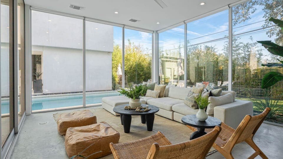 Unit 1304A: Bright, modern living area with floor-to-ceiling windows and stylish, comfortable seating.