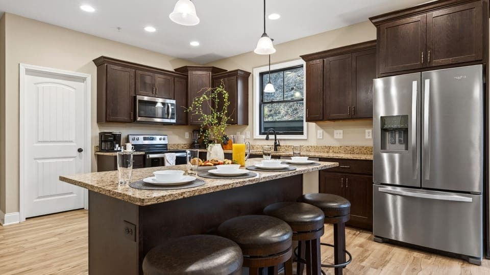A spacious, fully equipped kitchen with island seating—perfect for group meals and morning coffee.