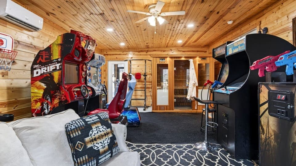 Turn downtime into playtime in the game room, featuring arcade machines, racing games, and a private sauna for the ultimate Smoky Mountains retreat.