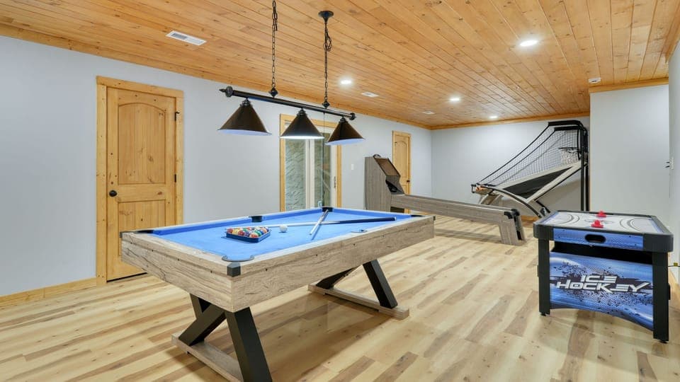 Game room featuring a pool table, basketball hoop, and air hockey table. (Perfect Too)