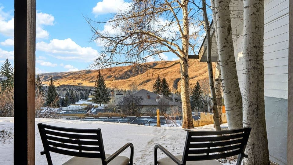 Peaceful patio seating with mountain views—sip your coffee in the crisp Vail air before heading out for the day.