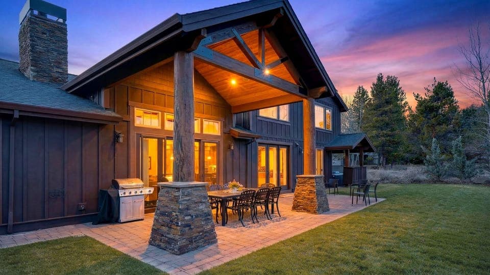 Golden-hour magic at the lodge—gather under the covered patio, fire up the grill, and unwind beneath a sunset sky.