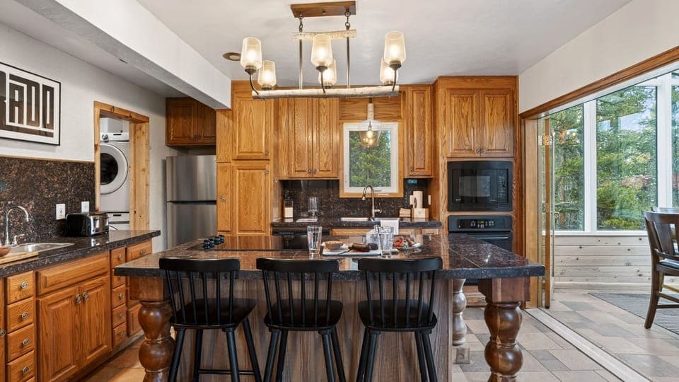 Warm, rustic kitchen with spacious island seating.