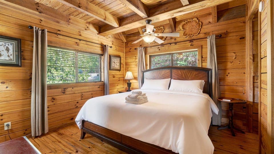 The primary bedroom features a king bed, TV and an ensuite bathroom.