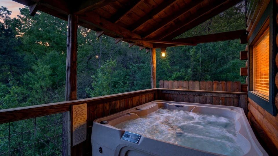 Private covered hot tub tucked in the trees—perfect for soaking under the stars after a day in the Smokies.