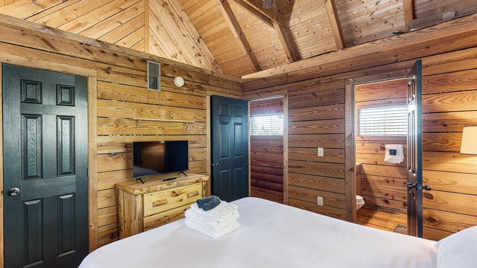 Bedroom 2 features a queen bed, TV and an ensuite bathroom. (Maggie's Cabin)