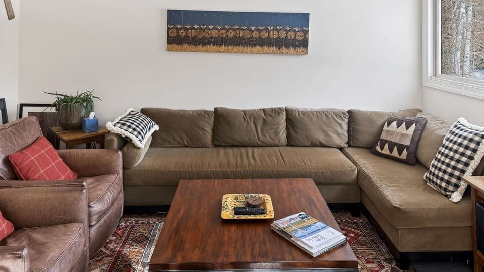 Cozy living room with plush seating, rustic textures, and plenty of space to unwind.