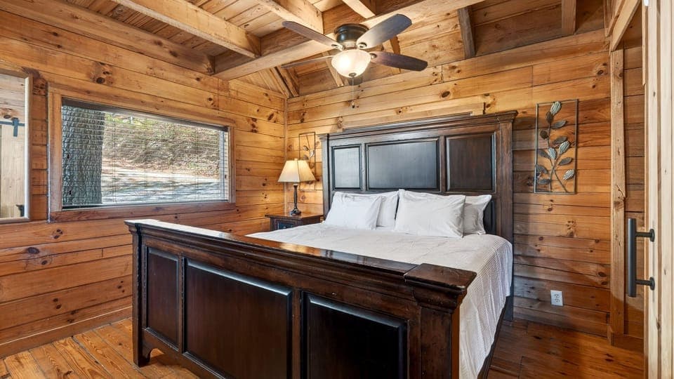 The primary bedroom features a king bed, TV and an ensuite bathroom. (Elijah's Cabin)