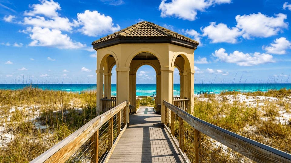 Picturesque boardwalk and gazebo overlooking the emerald Gulf.