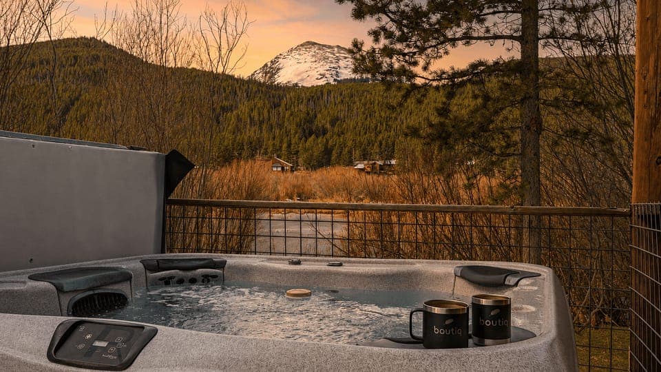 Soak in the private hot tub while taking in snow-capped mountain views and peaceful alpine scenery.