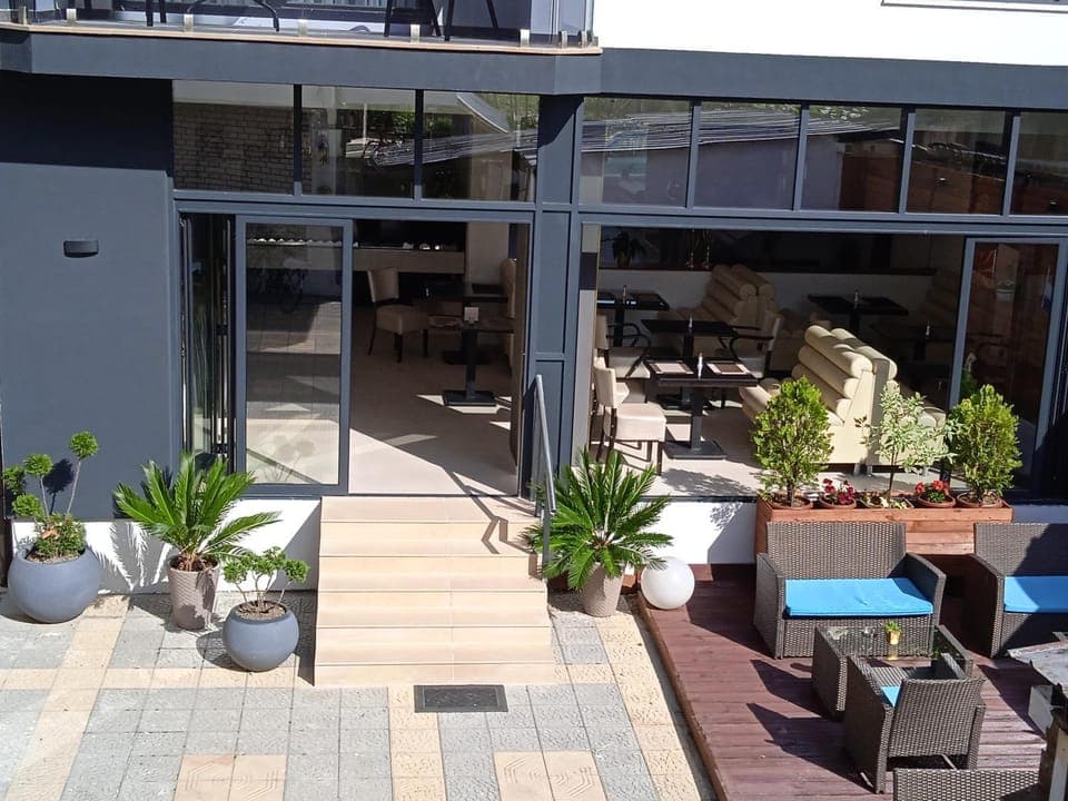 Property building, Patio, Restaurant/places to eat, Day, View (from property/room), Seating area