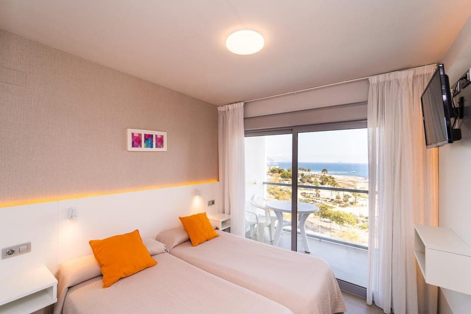 Bed, Natural landscape, TV and multimedia, View (from property/room), Bedroom, Sea view