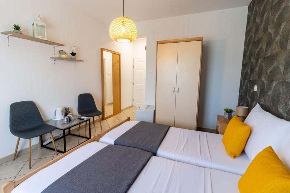 Bed, Seating area, hair dresser, wardrobe