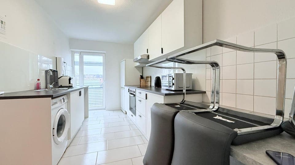 Kitchen or kitchenette, dishwasher, oven, stove, toaster