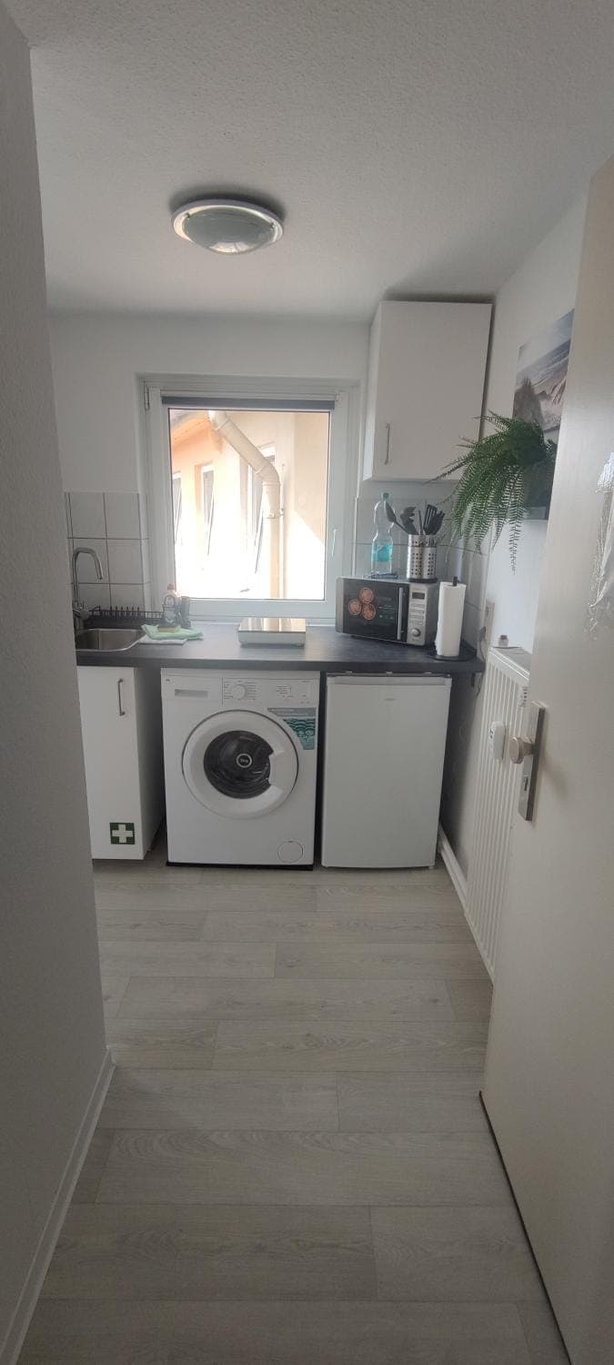 Kitchen or kitchenette, stove, washing machine