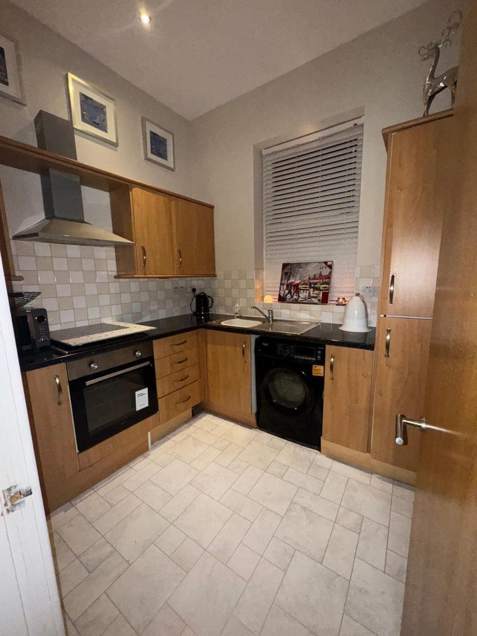 Kitchen or kitchenette, microwave, oven, stove, washing machine