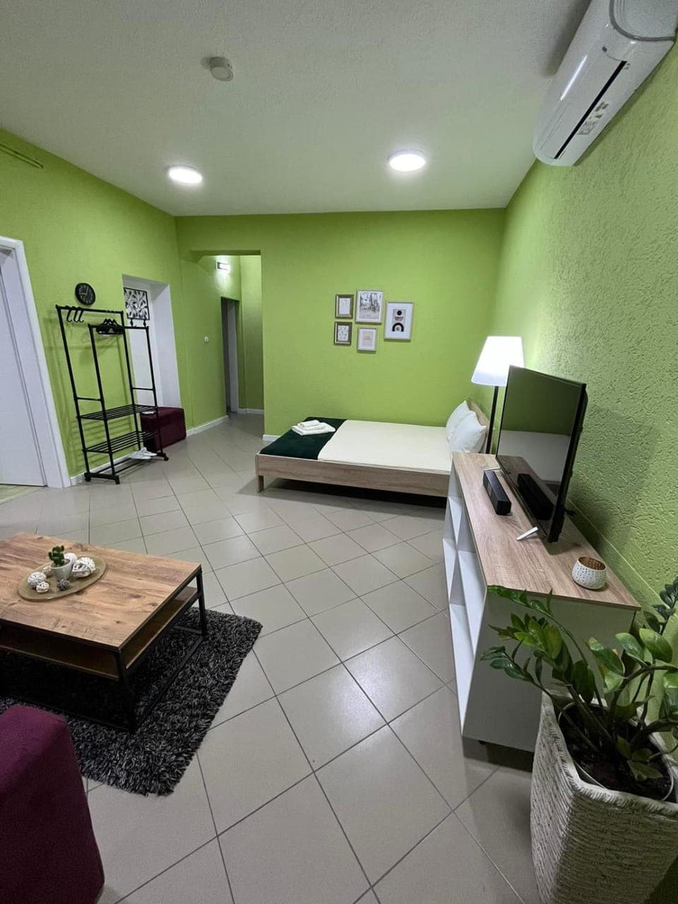 Bed, Living room, Seating area, Bedroom, air conditioner