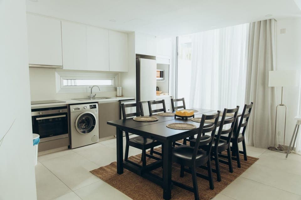 Kitchen or kitchenette, Seating area, Dining area, microwave, oven, stove, washing machine