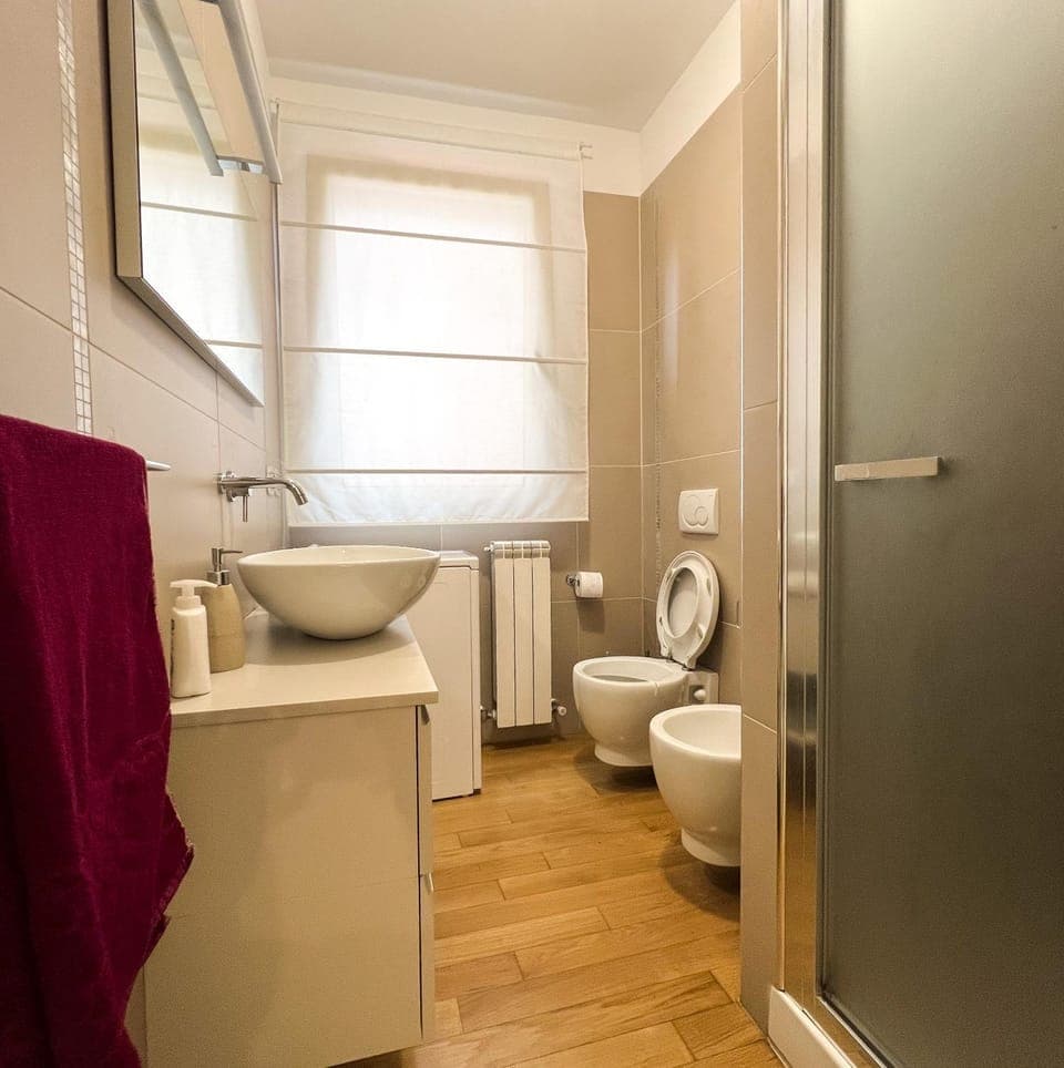 Shower, Toilet, Bathroom, bidet, towels, washing machine