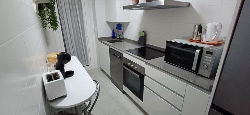 Kitchen or kitchenette, dishwasher, oven, stove, toaster