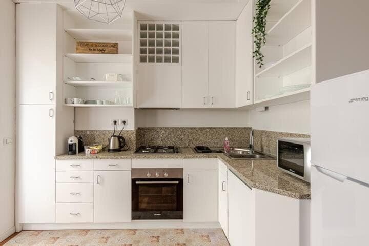 Kitchen or kitchenette, dishwasher, oven, stove