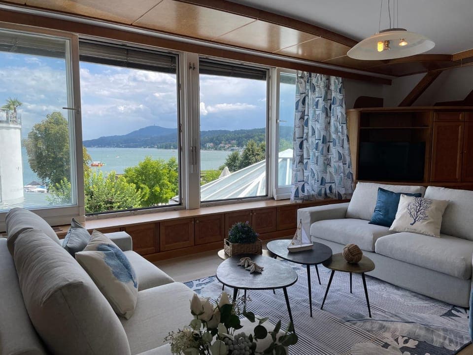 Natural landscape, View (from property/room), Living room, Seating area, Lake view, Mountain view