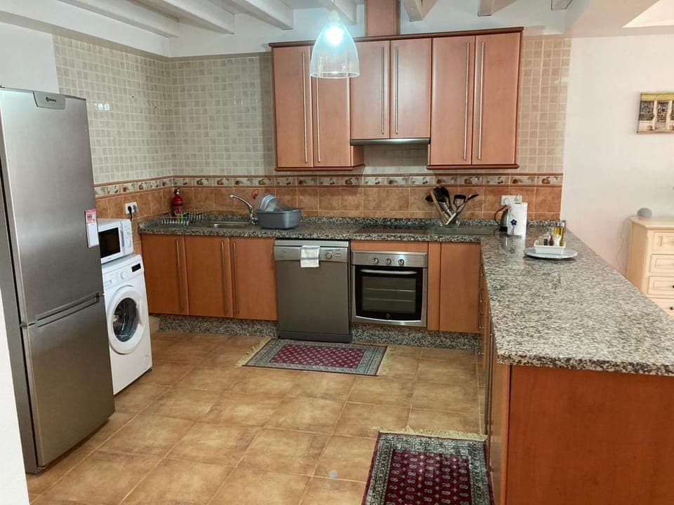 Kitchen or kitchenette, dishwasher, stove, toaster, washing machine