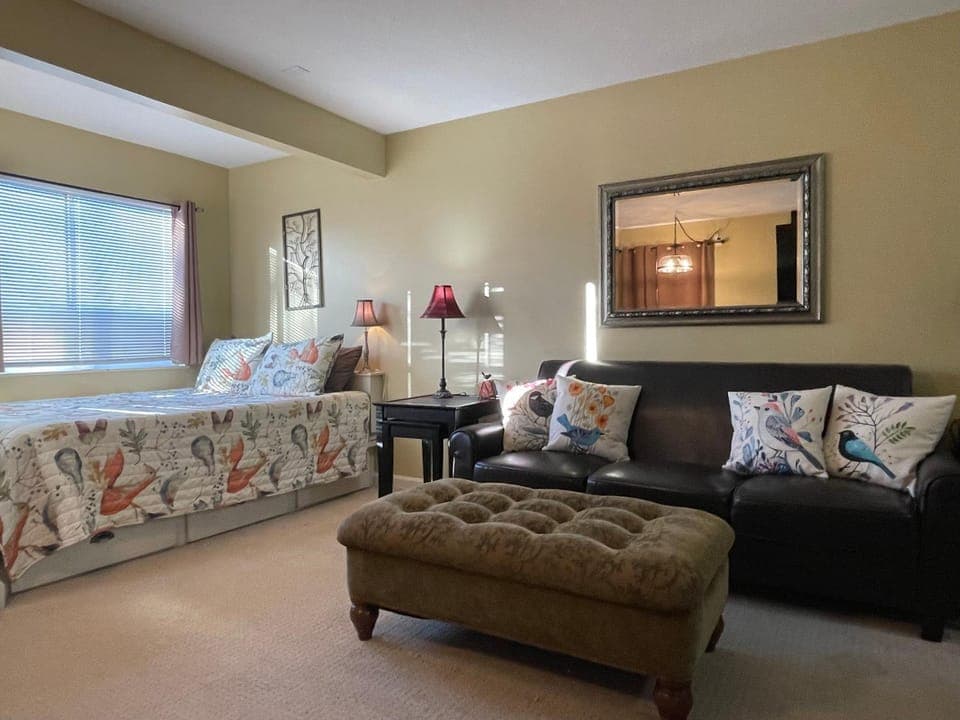 Bed, Living room, Seating area, Bedroom