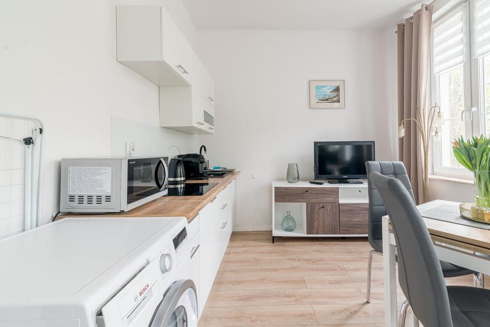 TV and multimedia, Kitchen or kitchenette, Decorative detail, Dining area, minibar, stove, washing machine, dryer